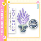 a decorative arrangement of purple flowers in a vase, along with a sign that says "Lavender" and a small circular sign that says "Hello".