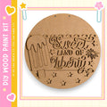 a wooden sign with the text "Sweet Land of Liberty" carved into it, along with a decorative ice cream cone.