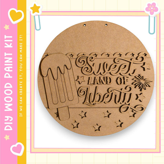 a wooden sign with the text "Sweet Land of Liberty" carved into it, along with a decorative ice cream cone.