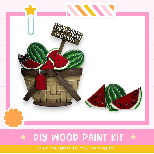 The image is a DIY wood paint kit featuring a basket filled with watermelon slices and a sign that says "Farm Fresh Watermelon". The kit appears to be made of wood and is designed for painting.