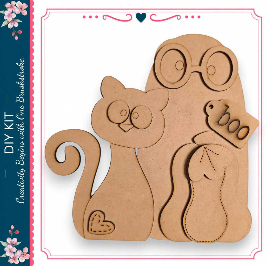 a DIY kit with a cat and a ghost, along with some other wooden shapes.