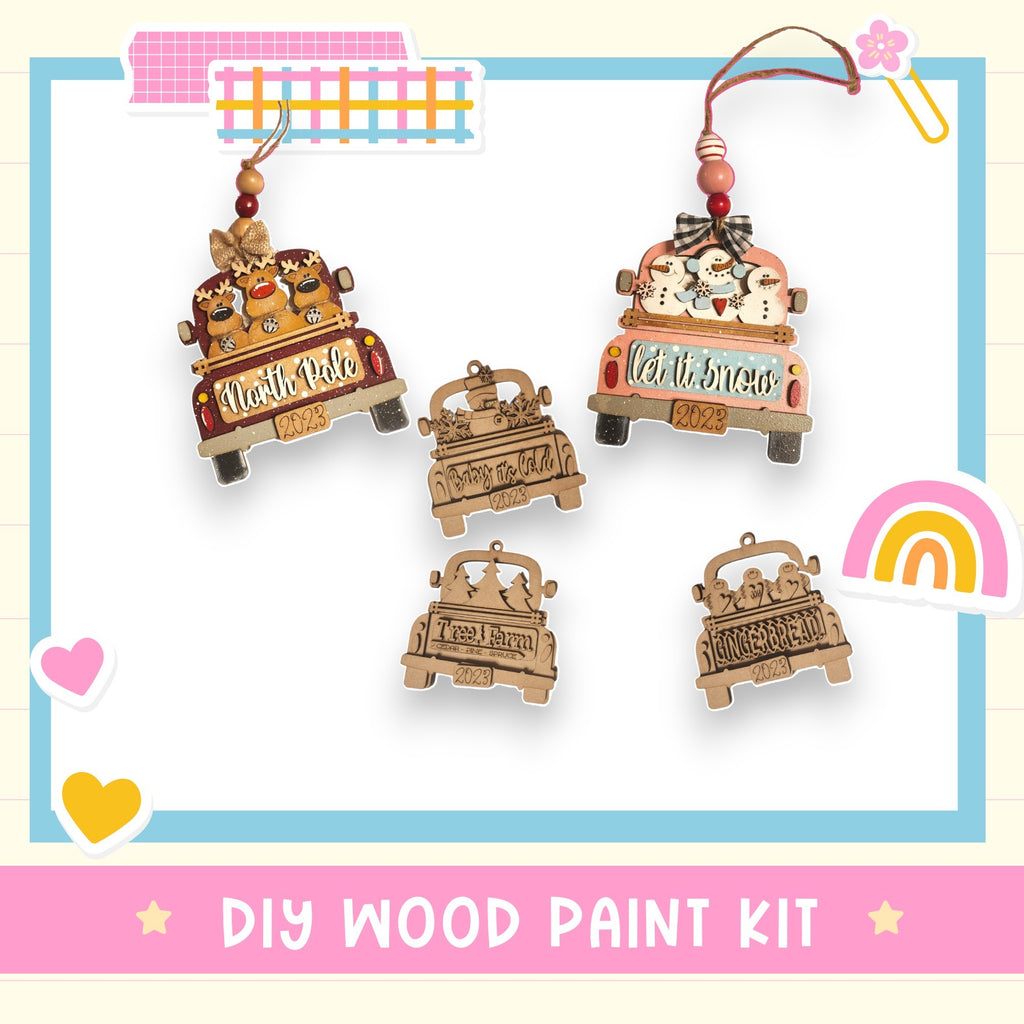 a DIY wood paint kit with various wooden ornaments, including a truck ornament and a snowman ornament, as well as a heart and a rainbow.