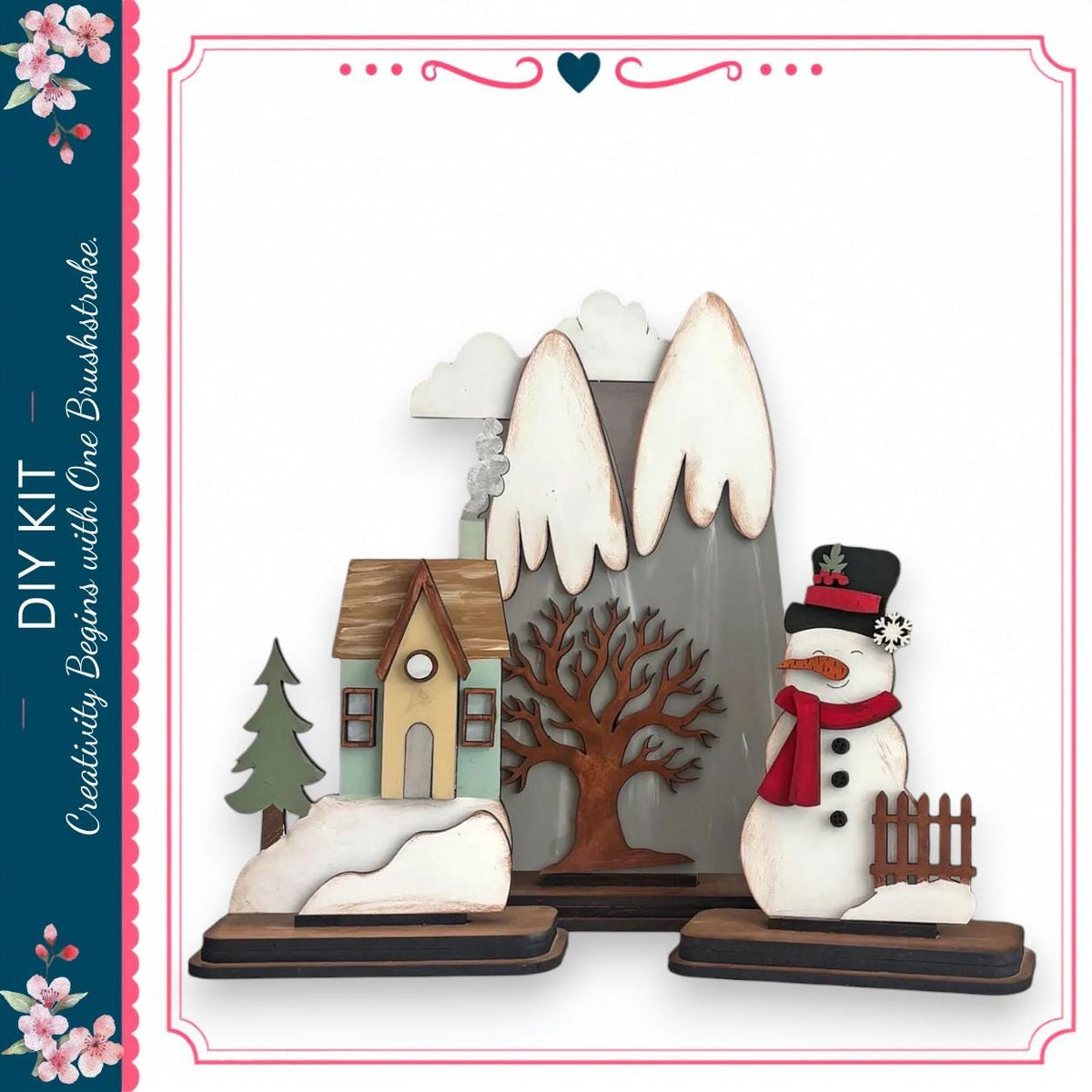 a snowman and a small house, both made of wood and decorated with various winter elements such as a scarf, hat, and carrot nose.