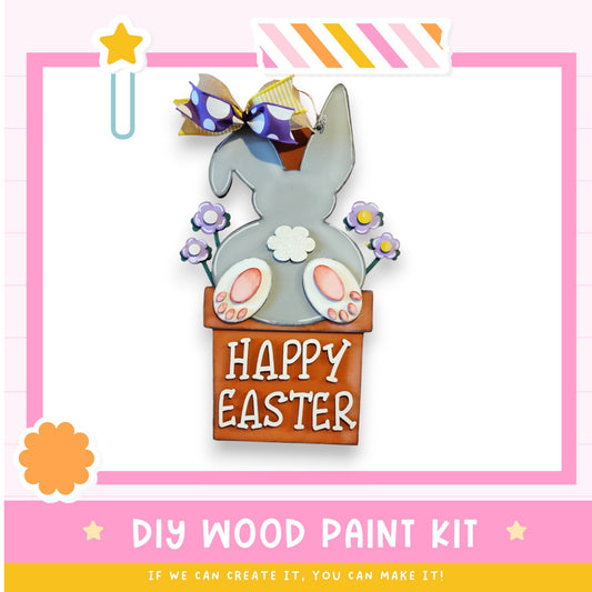 a picture of a happy easter bunny in a box