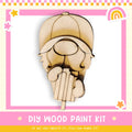 a wooden cutout of a woman's head