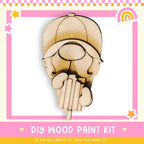 a wooden cutout of a woman's head