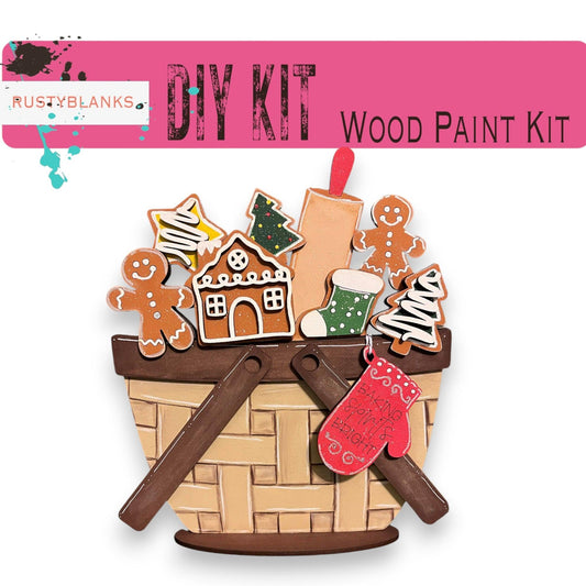 a wooden paint kit with a basket of gingerbreads