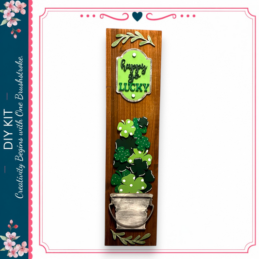 a wooden sign with a pot of shamrocks and the text "Happy St. Patrick's Day" on it.