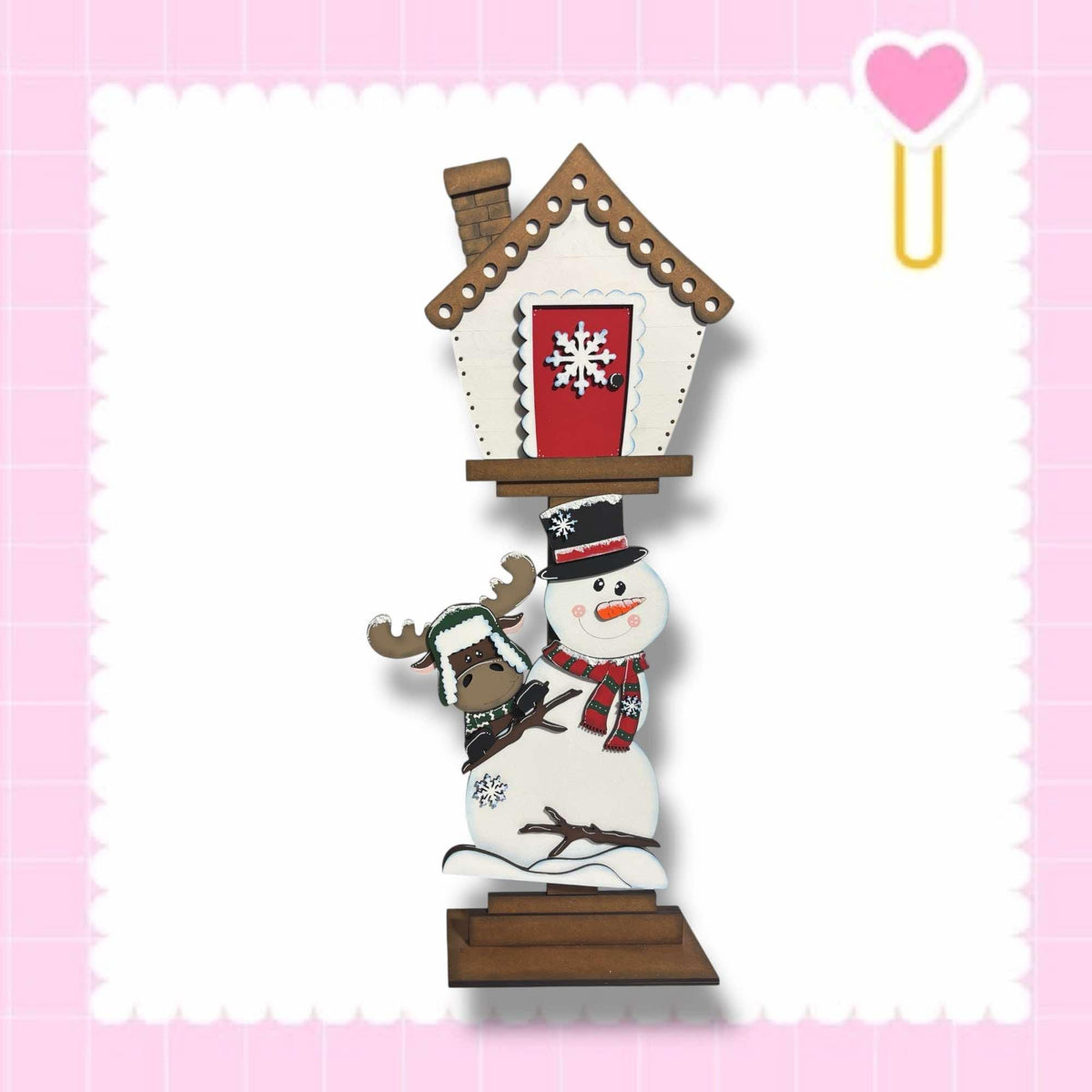a snowman with a house on top of it