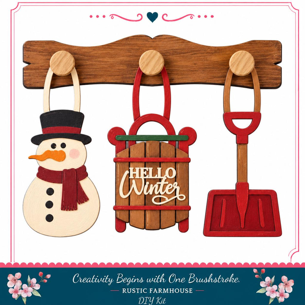 a wooden snowman, a wooden sled with the word "Hello Winter" written on it, and a red shovel, all hanging on a wooden board.