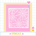 a pink background with a white spider web pattern.