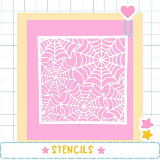 a pink background with a white spider web pattern.