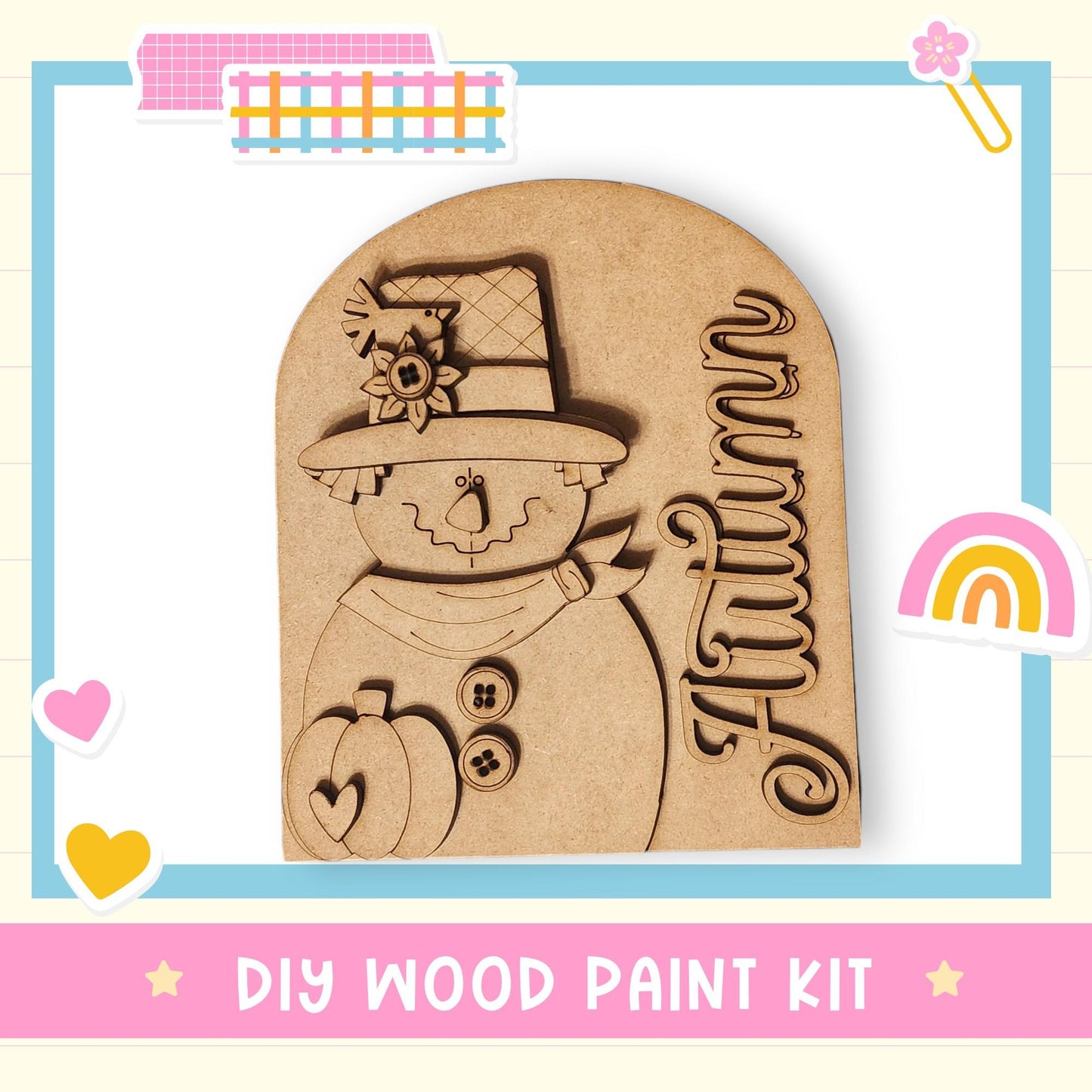 A DIY wood paint kit featuring a wooden scarecrow with a hat and a pumpkin, surrounded by colorful stickers and a rainbow.