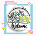 a picture of a welcome sign with flowers and butterflies