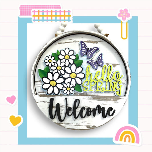 a picture of a welcome sign with flowers and butterflies