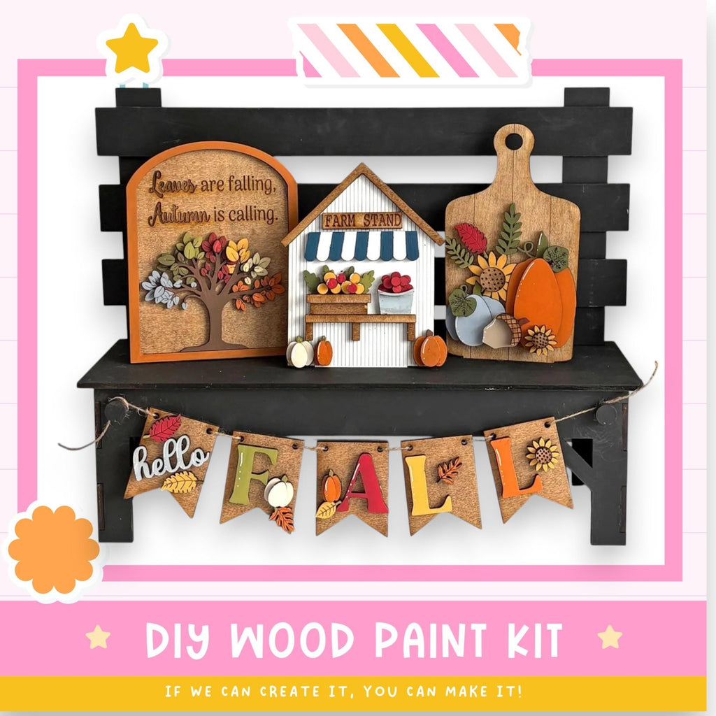 The image is a DIY wood paint kit for creating fall-themed decorations, including a wooden bench with a sign that says "Autumn is calling" and a small wooden house with a "FARM STAND" sign. The kit also includes a banner that says "Hello FALL" and a wooden pumpkin. The image is described as a "collage of multiple images" and "if we can create it, you can make it!"