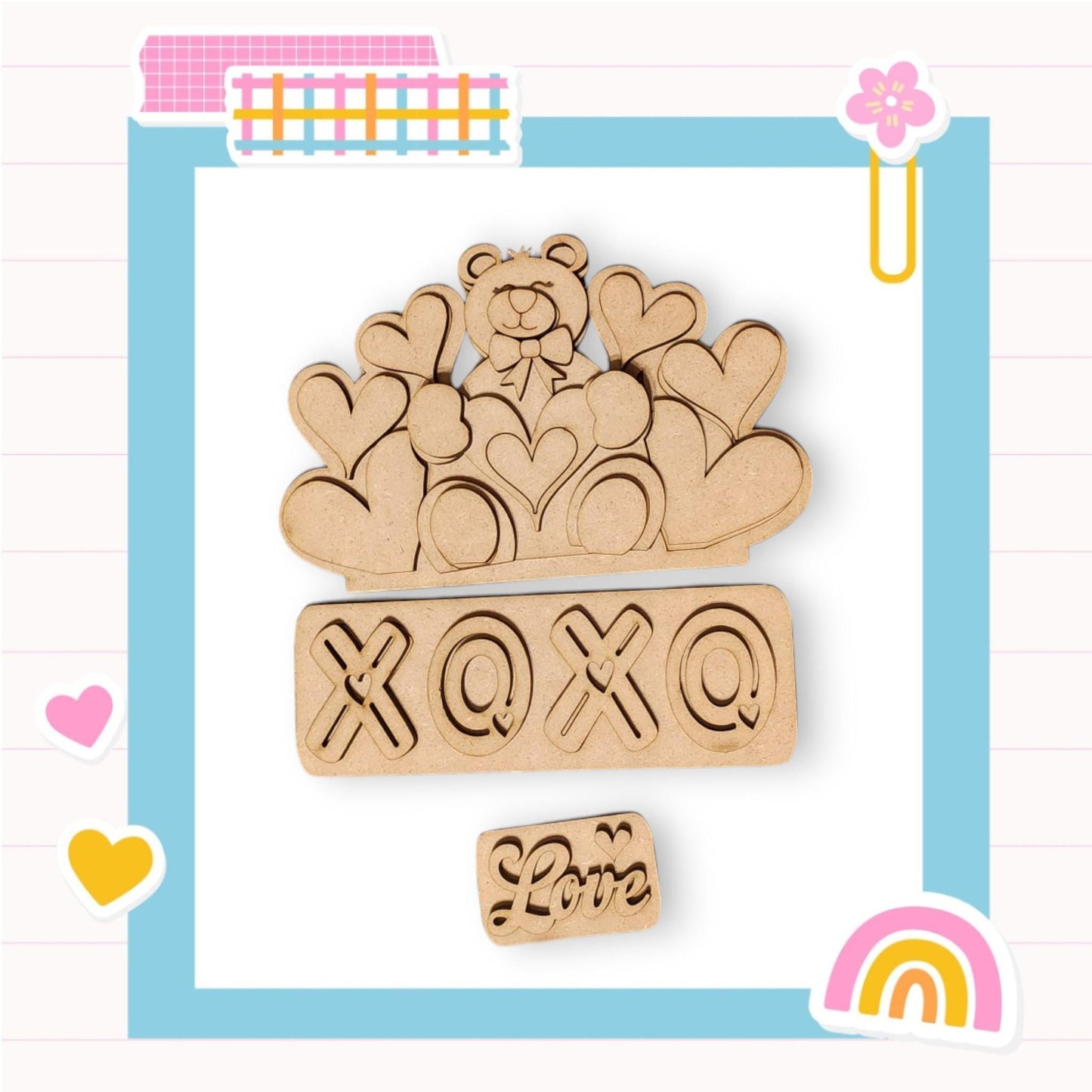 a wooden brooch with a teddy bear sitting on top of it