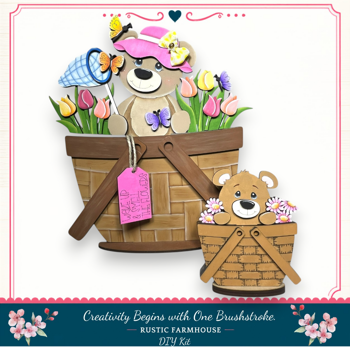 A wooden basket with a teddy bear and flowers inside, and a smaller wooden basket with a teddy bear and flowers inside, both decorated with colorful flowers and butterflies.