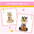 The image is a DIY wood paint kit featuring two wooden reindeer ornaments. The kit appears to be designed for creating these ornaments, as indicated by the text "DIY WOOD PAINT KIT" and "If we can create it, you can make it!" The kit includes the necessary materials and instructions for crafting the wooden reindeer ornaments.