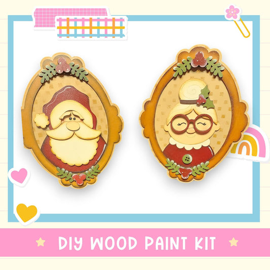two wooden frames with illustrations of Santa Claus and an elderly woman, likely representing a DIY wood paint kit for creating wooden decorations.