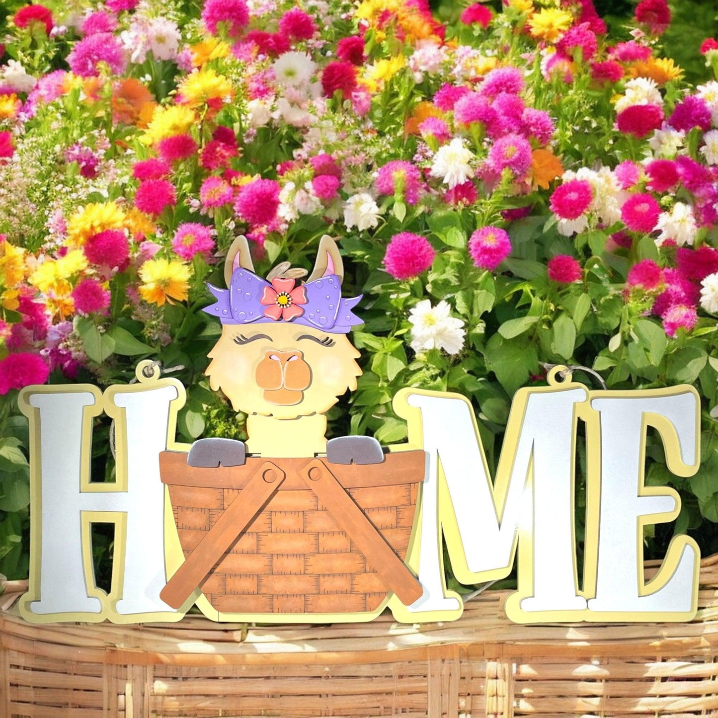 a wooden sign that says home in front of flowers