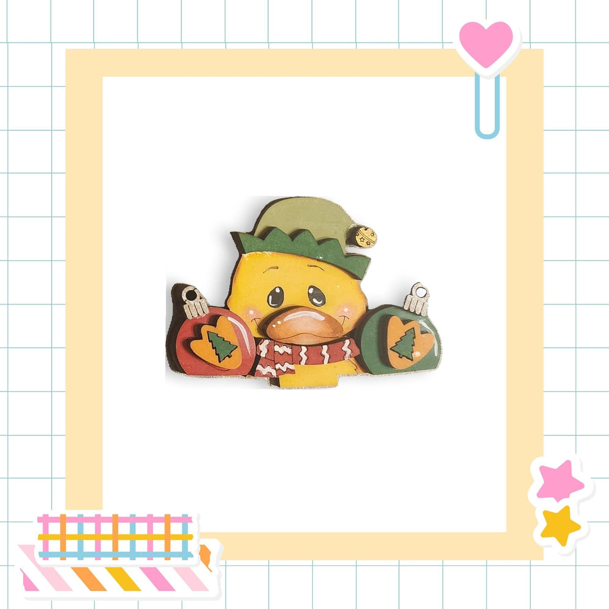 A cheerful cartoon duck wearing a green hat and holding Christmas ornaments, set against a white background with a grid pattern.