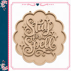 a wooden sign with the text "Stay for a Spell" carved into it.