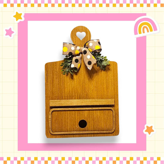 a wooden box with a bow on top of it