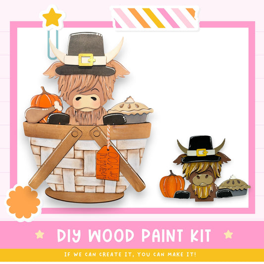 The image is a DIY wood paint kit featuring a wooden basket with a cartoon character wearing a Thanksgiving hat, along with a wooden pumpkin and a wooden pie.