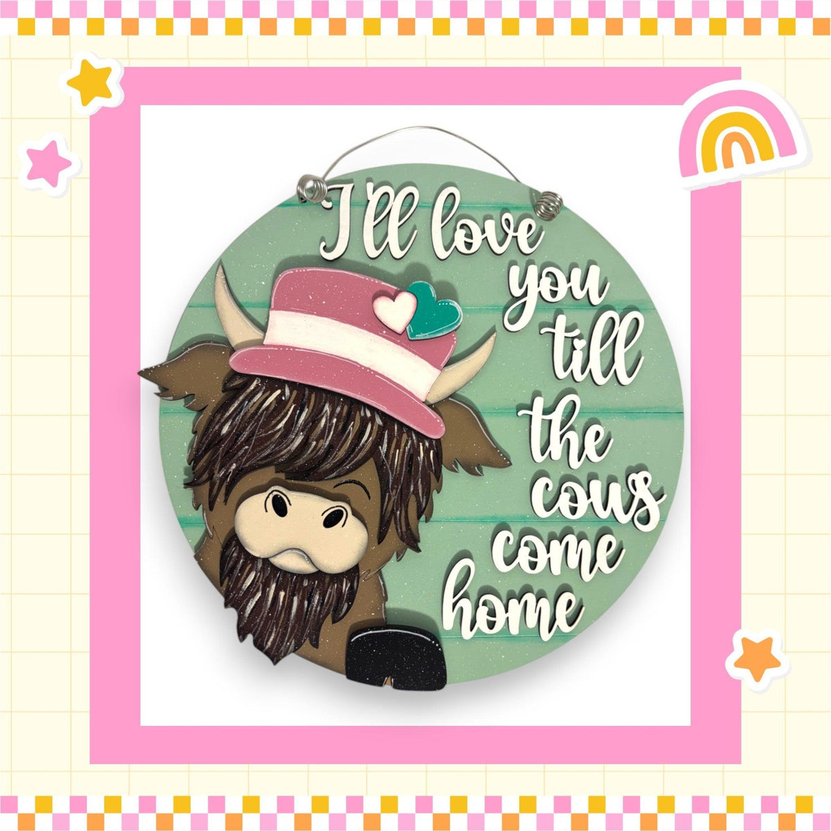 a button with a picture of a cow wearing a hat