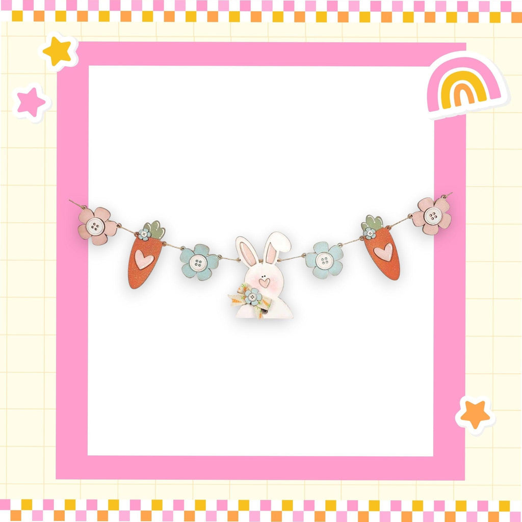 a picture frame with a bunny and carrots on it