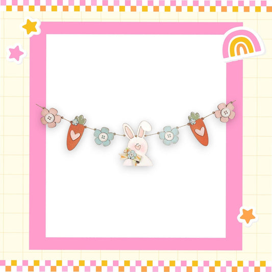 a picture frame with a bunny and carrots on it