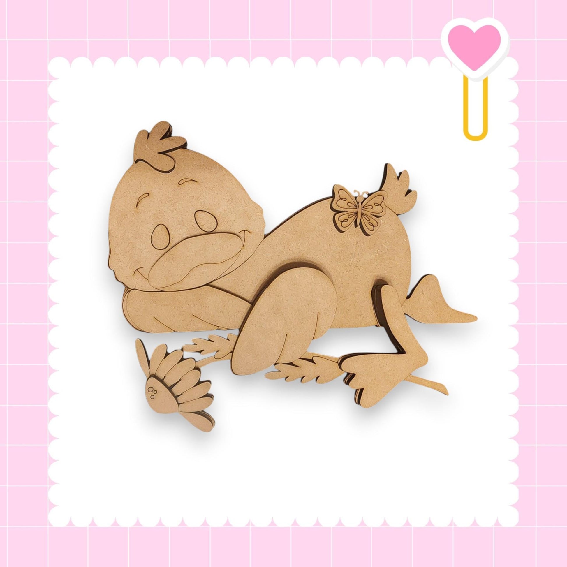 A wooden cutout of a smiling duck with a flower in its beak is displayed against a pink background with a heart shape.
