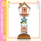A wooden gnome figurine holding a honey pot, with a small house-like structure above it.