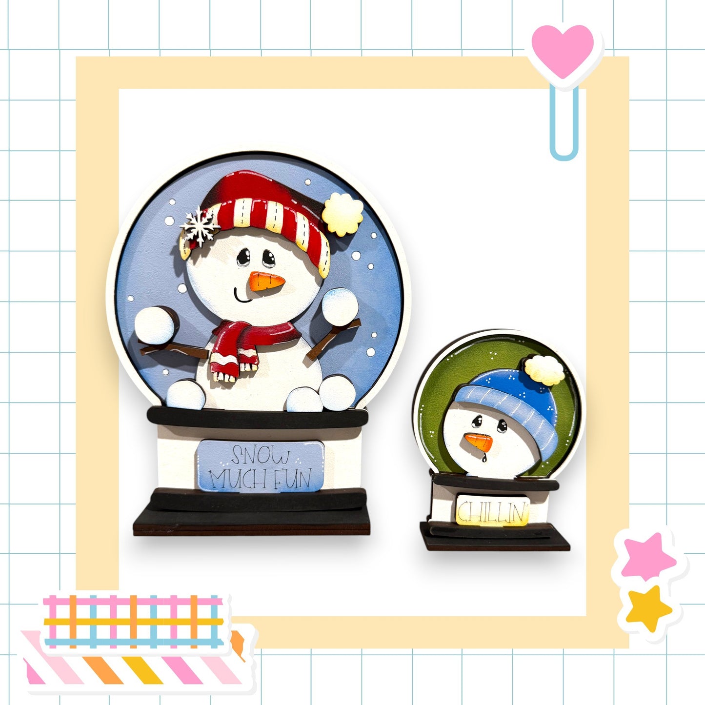 two snowmen, one larger and one smaller, both wearing winter hats and scarves. They are set against a background with a grid pattern.