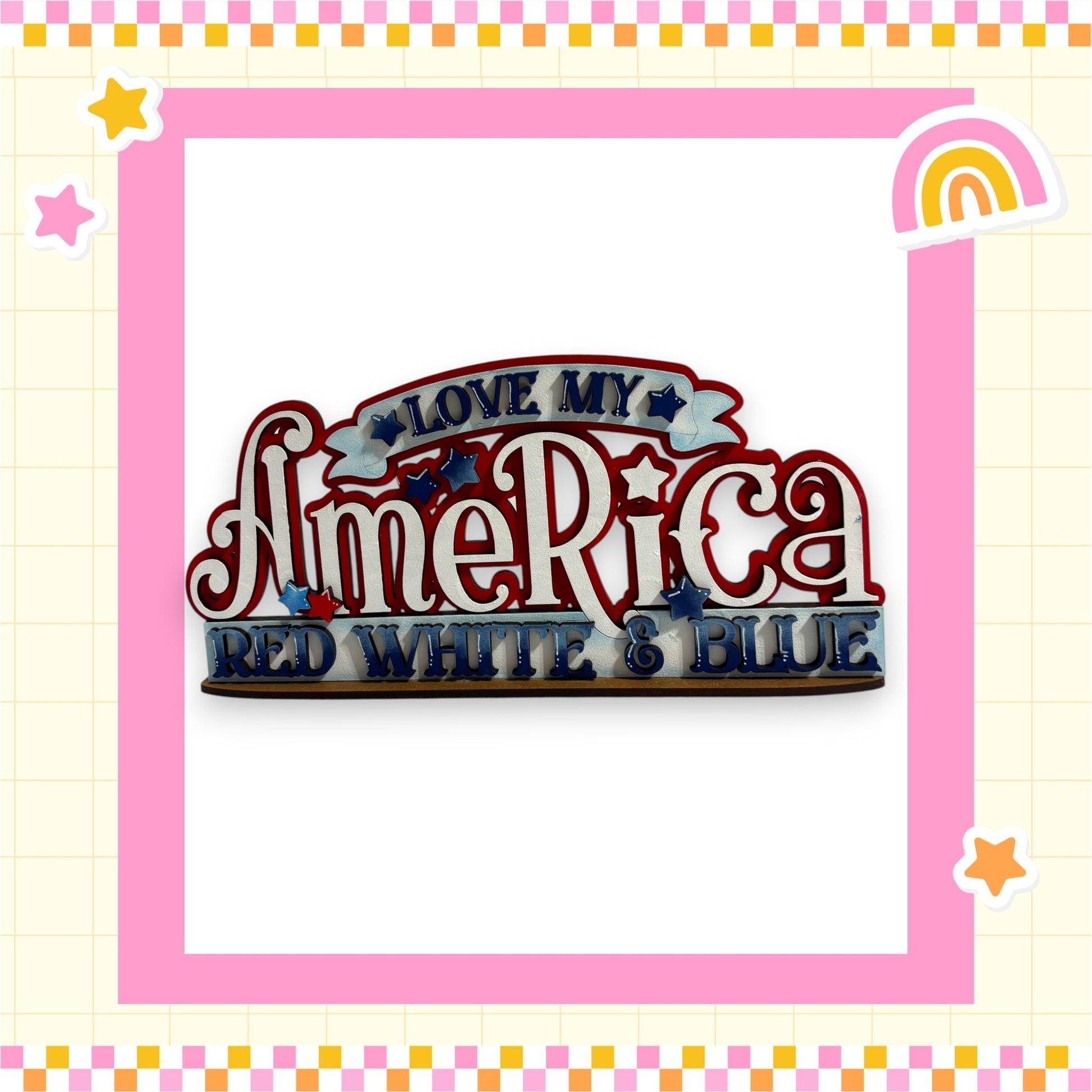 a colorful and playful design with the text "LOVE MY AMERICA RED WHITE & BLUE" prominently displayed. The design is framed by a pink border and includes various decorative elements such as stars and a rainbow.