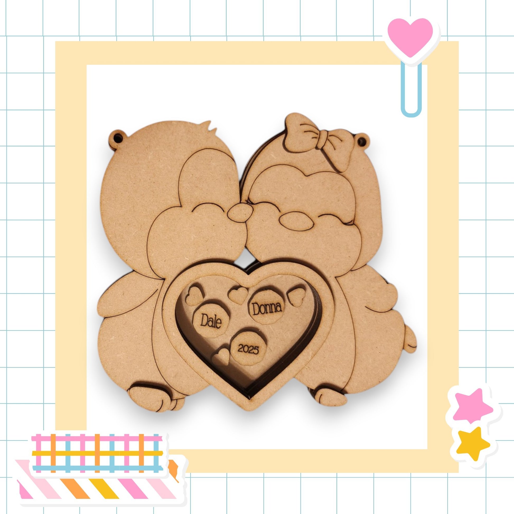 a couple of bears holding a heart shaped cookie