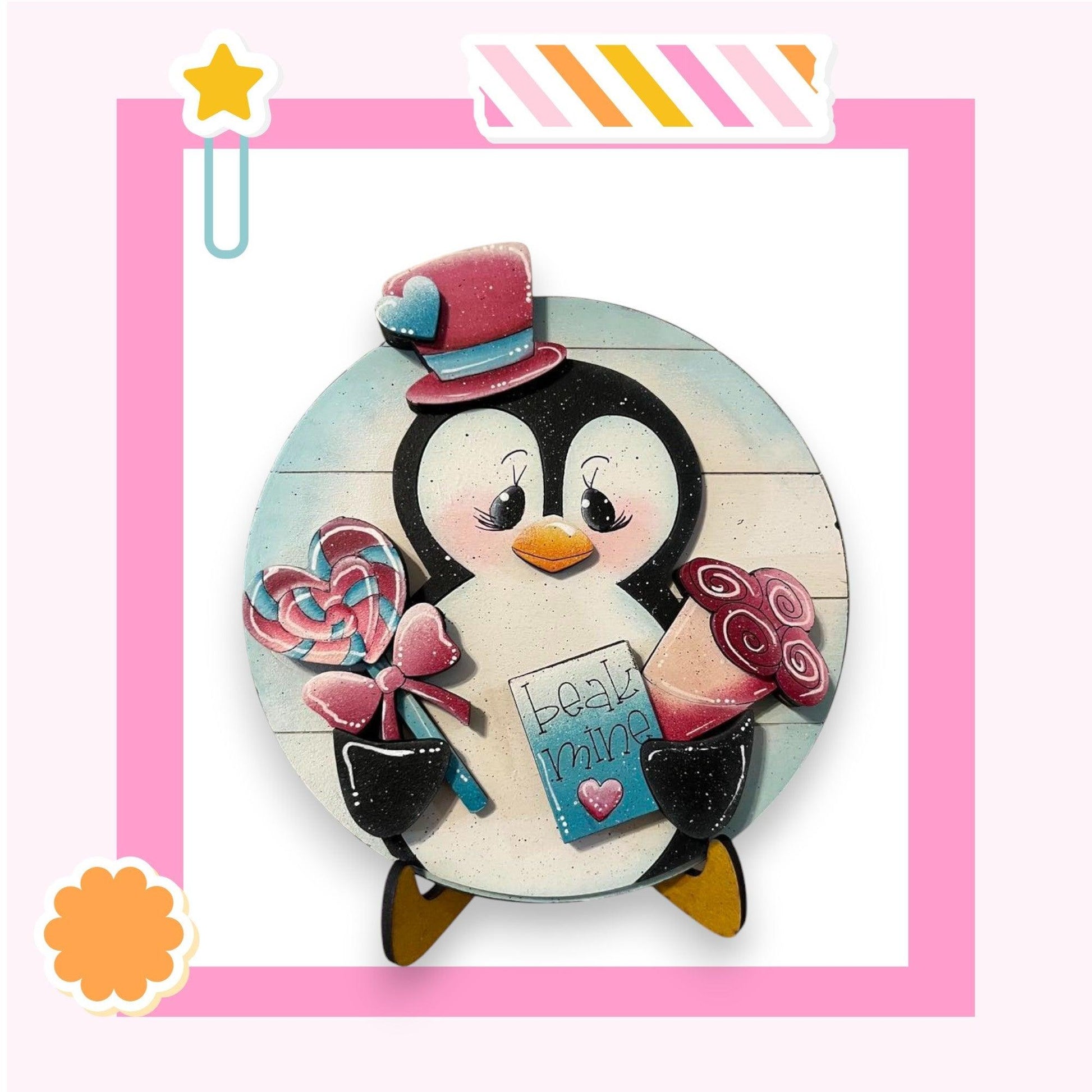 a picture of a penguin holding a candy lollypop