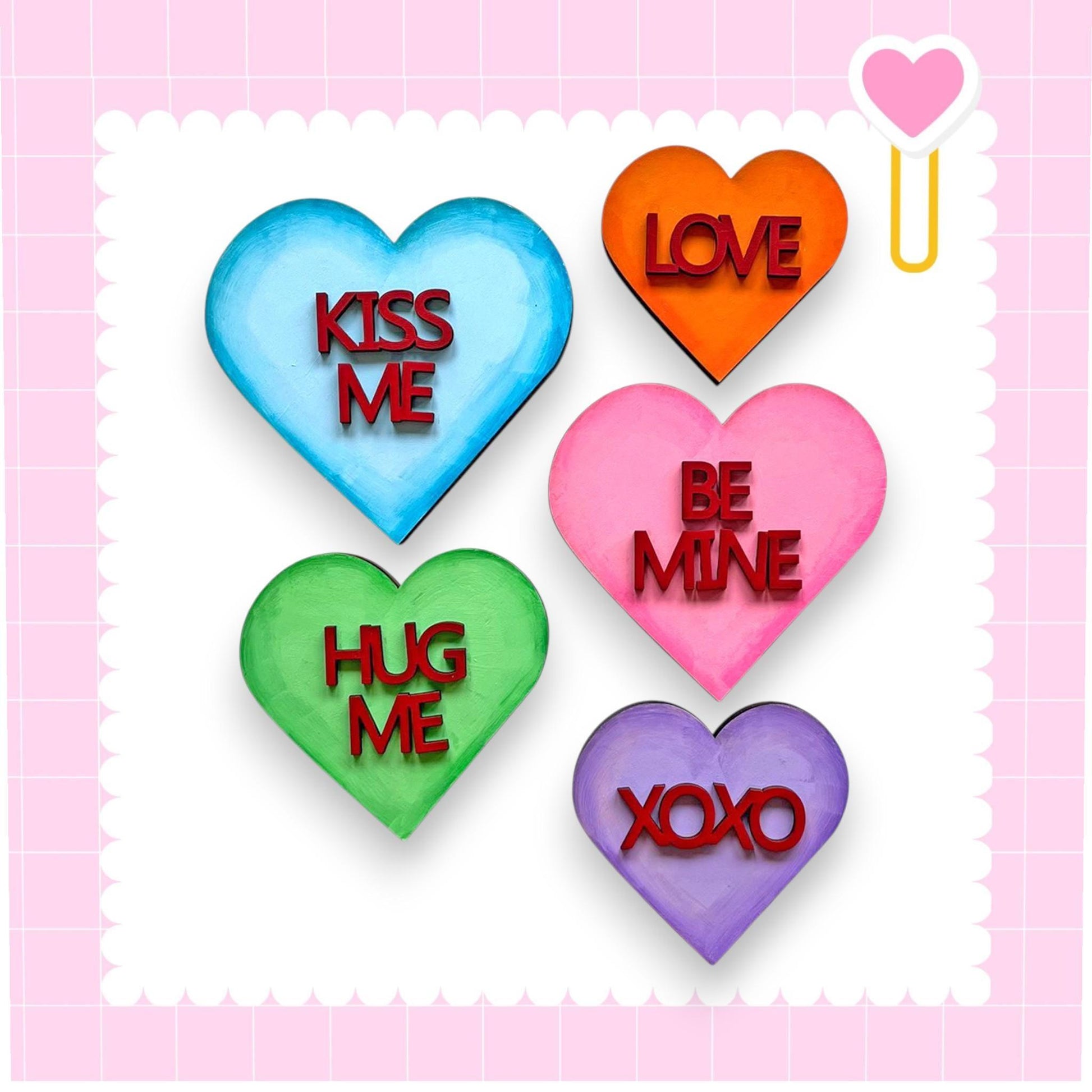 a set of four conversation hearts with the words kiss me, be mine, hug