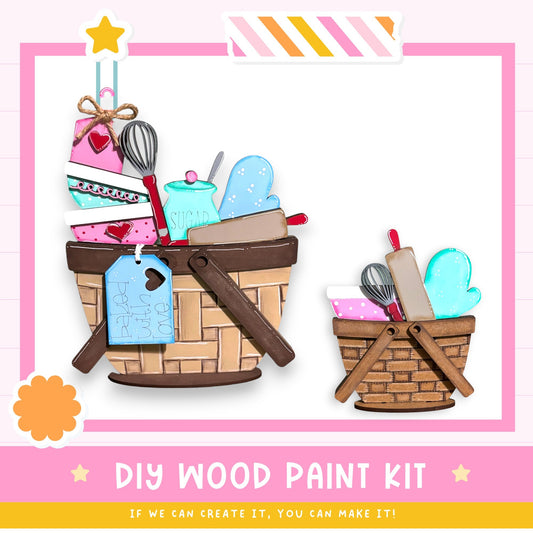 The image is a DIY wood paint kit, featuring a basket filled with various art supplies such as paintbrushes, a palette, and a star decoration. The text "DIY WOOD PAINT KIT" is displayed, along with the phrase "IF WE CAN CREATE IT, YOU CAN MAKE IT!" indicating that the kit is designed for creative individuals to make their own art supplies.