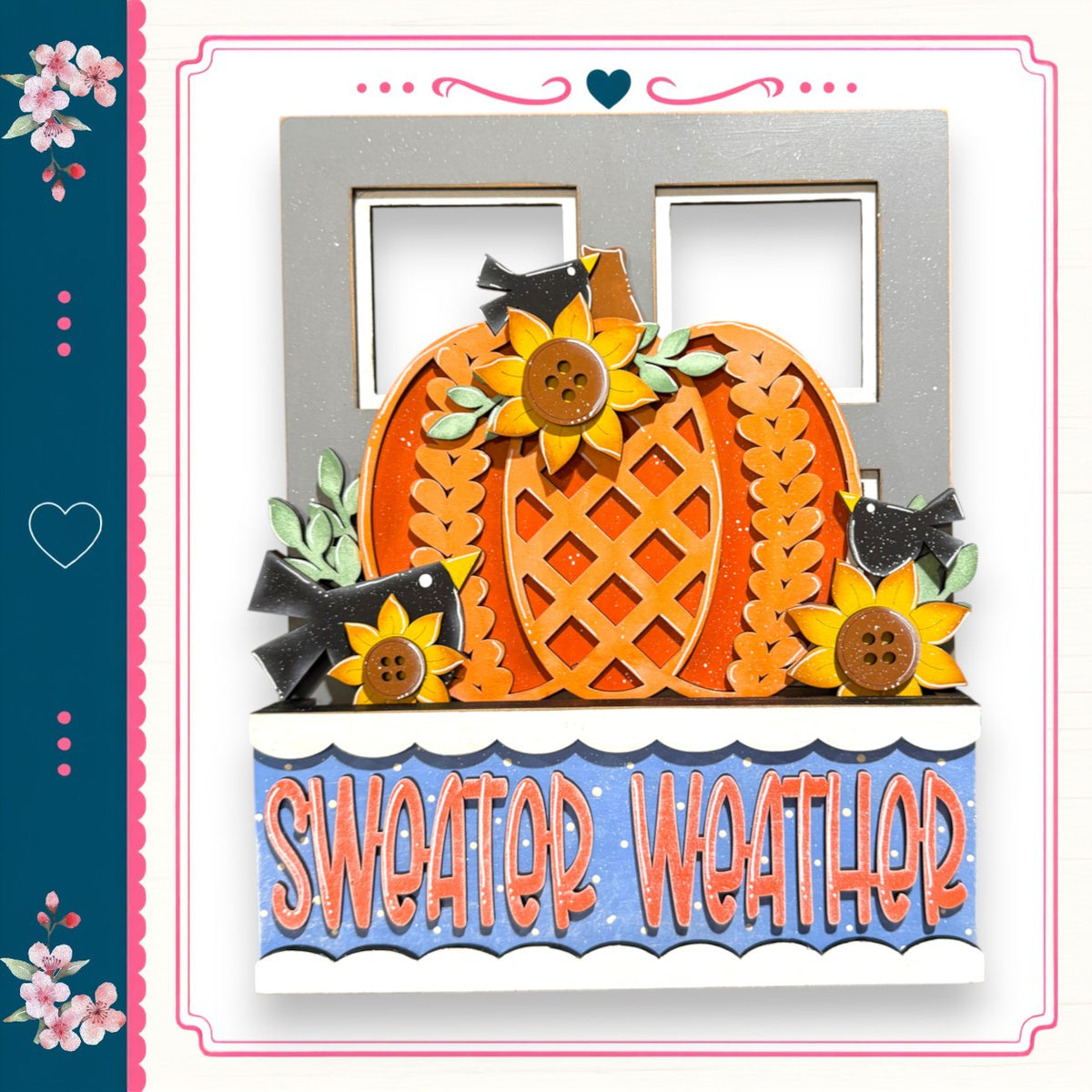 A decorative pumpkin with sunflowers and a bird, surrounded by the text "Sweater Weather" in a colorful frame.