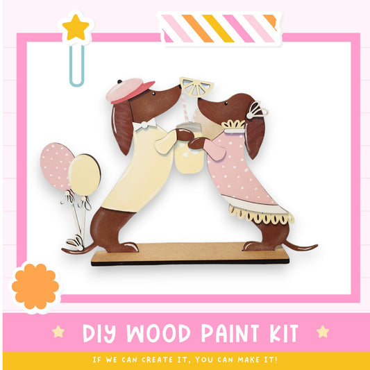 a wooden craft kit with a couple of dogs