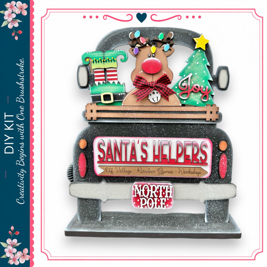 A festive Christmas-themed truck with a Santa Claus reindeer, a Christmas tree, and various holiday decorations.