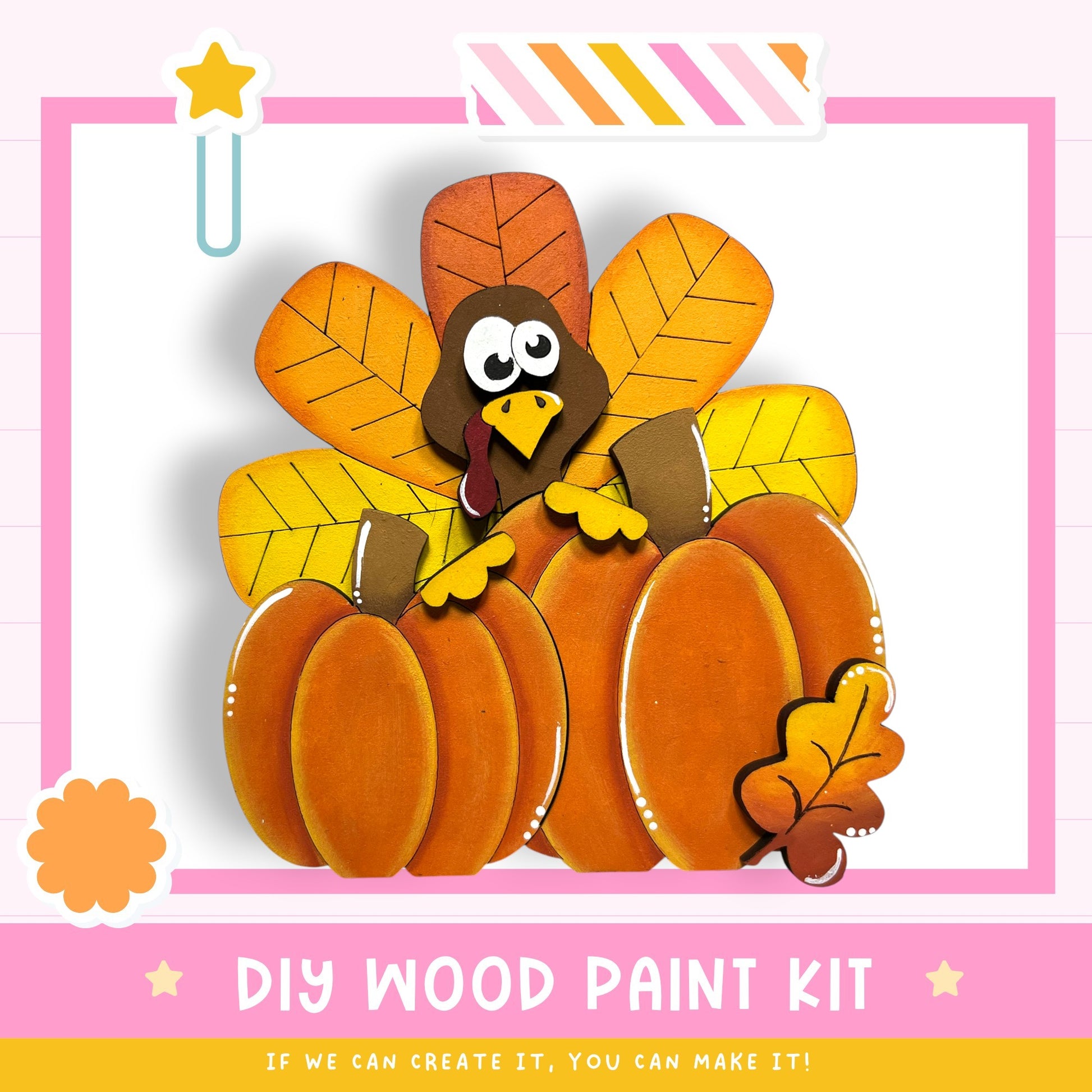 The image is a colorful and festive DIY wood paint kit featuring a turkey, pumpkins, and leaves, all set against a pink and white background.