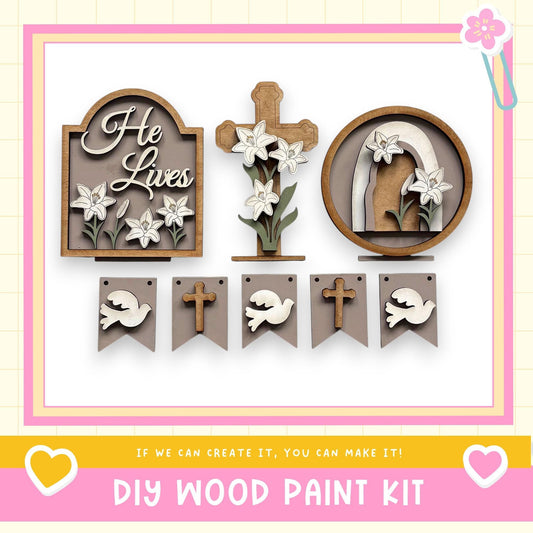 The image is a collage of various wooden decorations, including a cross, a floral design, and a banner with a dove. The text "He Lives" is displayed on the wooden cross, and the phrase "If we can create it, you can make it!" is written at the bottom of the image.