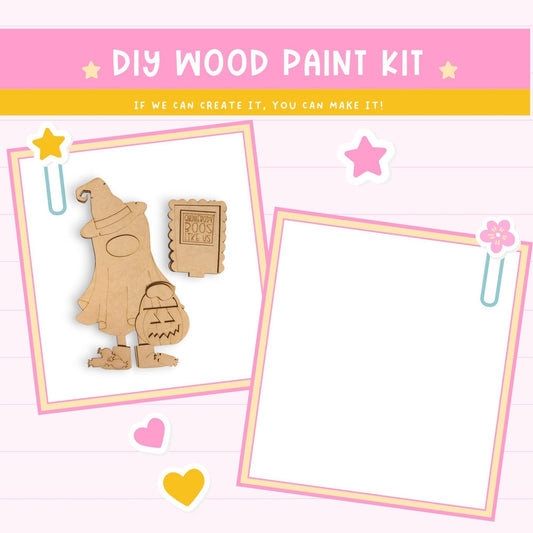 The image is a DIY wood paint kit with a wooden figure and various craft items, including a star, heart, and flower, all set against a pink background.