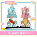 a couple of bunny figurines sitting next to each other