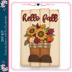 a wooden sign with the text "Hello Fall" and a decorative arrangement of sunflowers, pumpkins, and leaves.