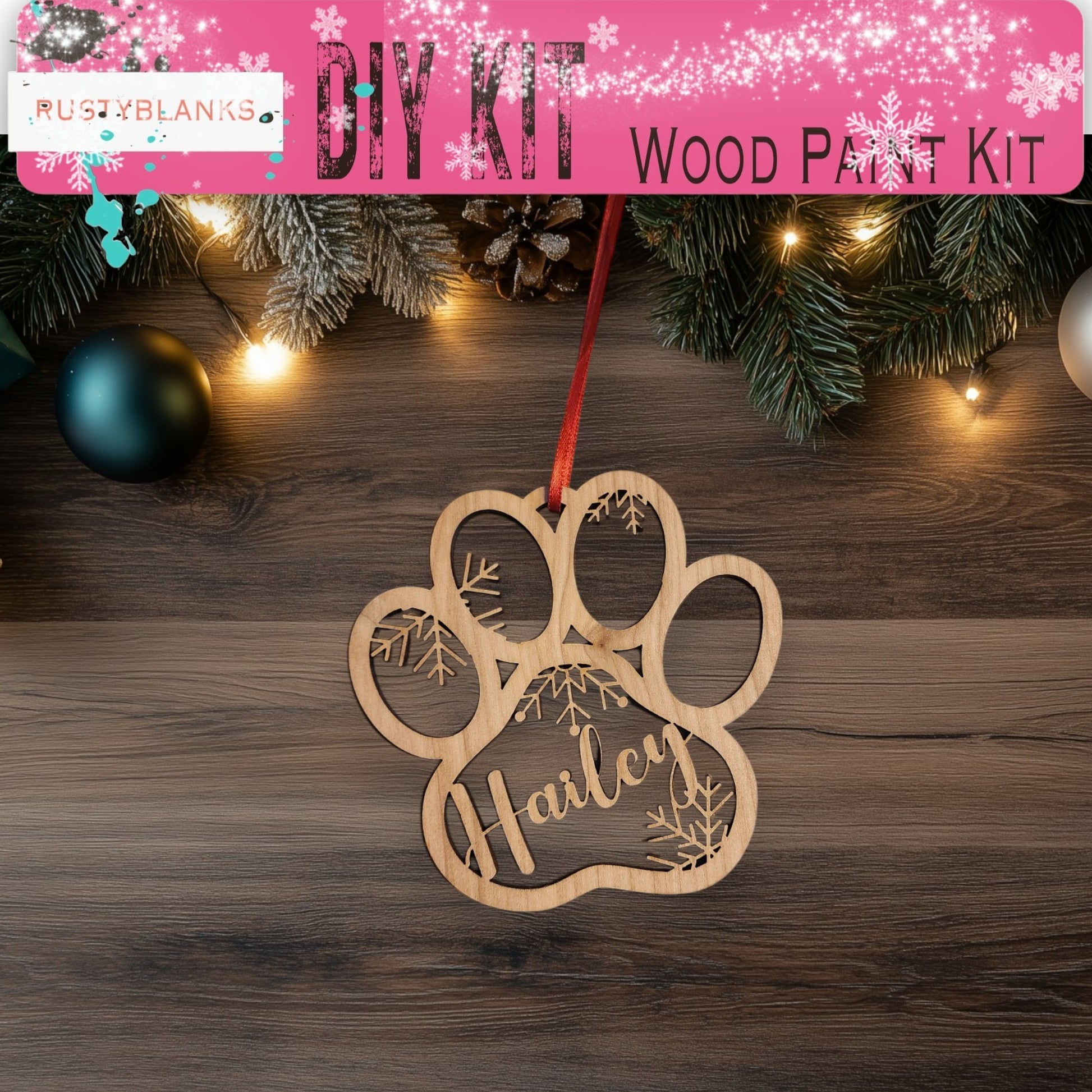 a dog paw ornament hanging from a christmas tree