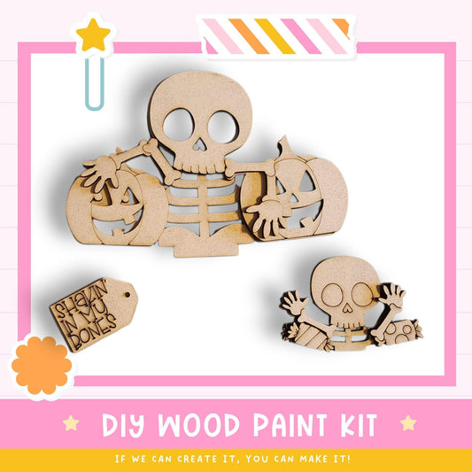 The image is a DIY wood paint kit featuring a skeleton and a pumpkin, with a tag that reads "SHEKIN IN YU BONES".
